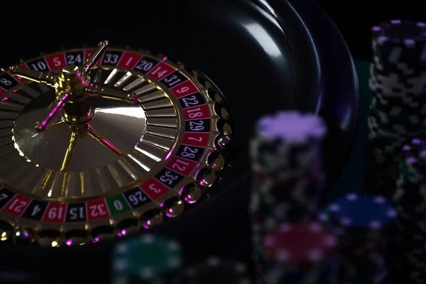 Baccarat cards and chip stacks on planet88 slot live dealer table